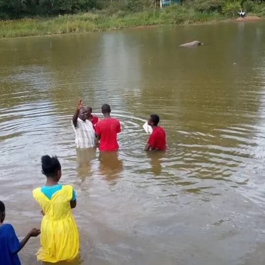 Baptism service in a river