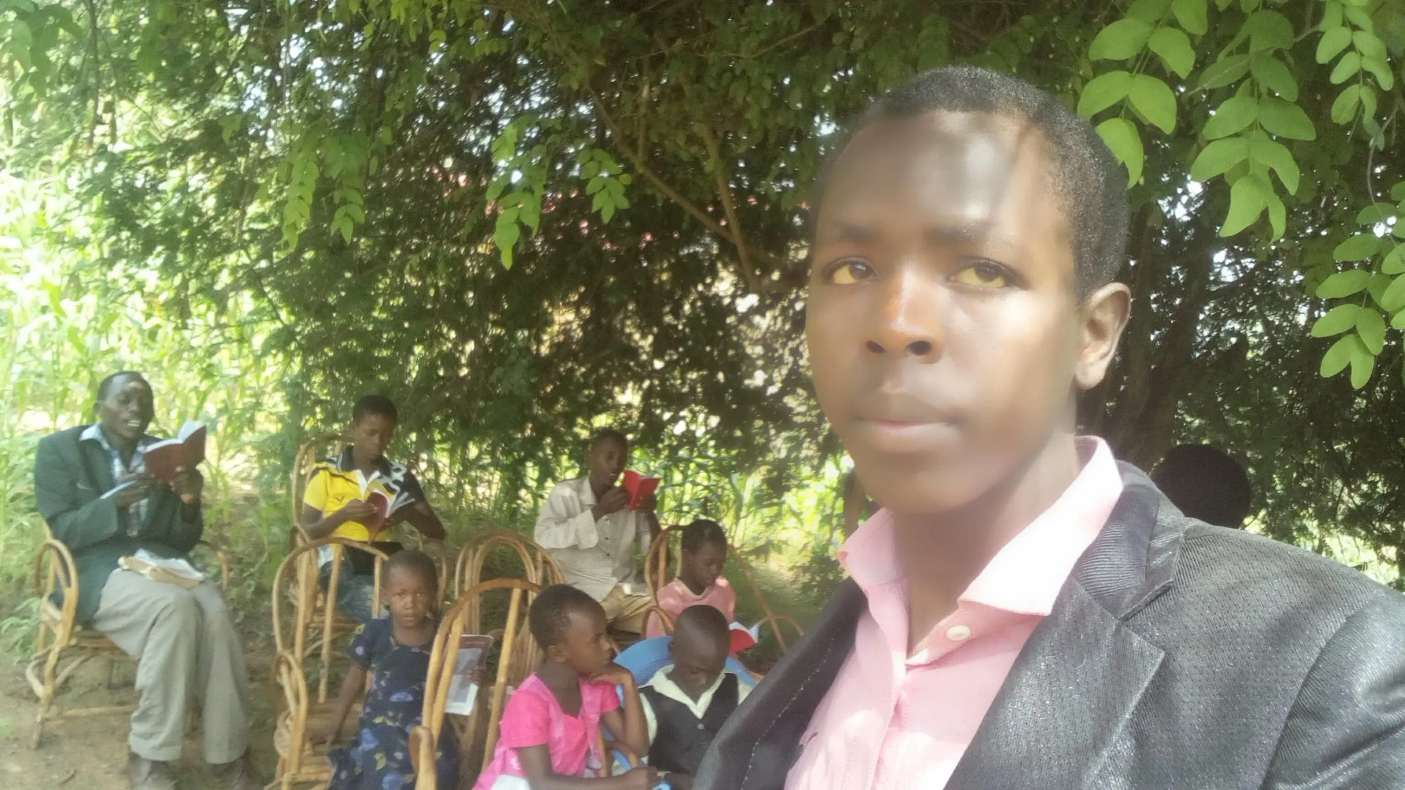 Small Sabbath School gathering under a tree in Yongela