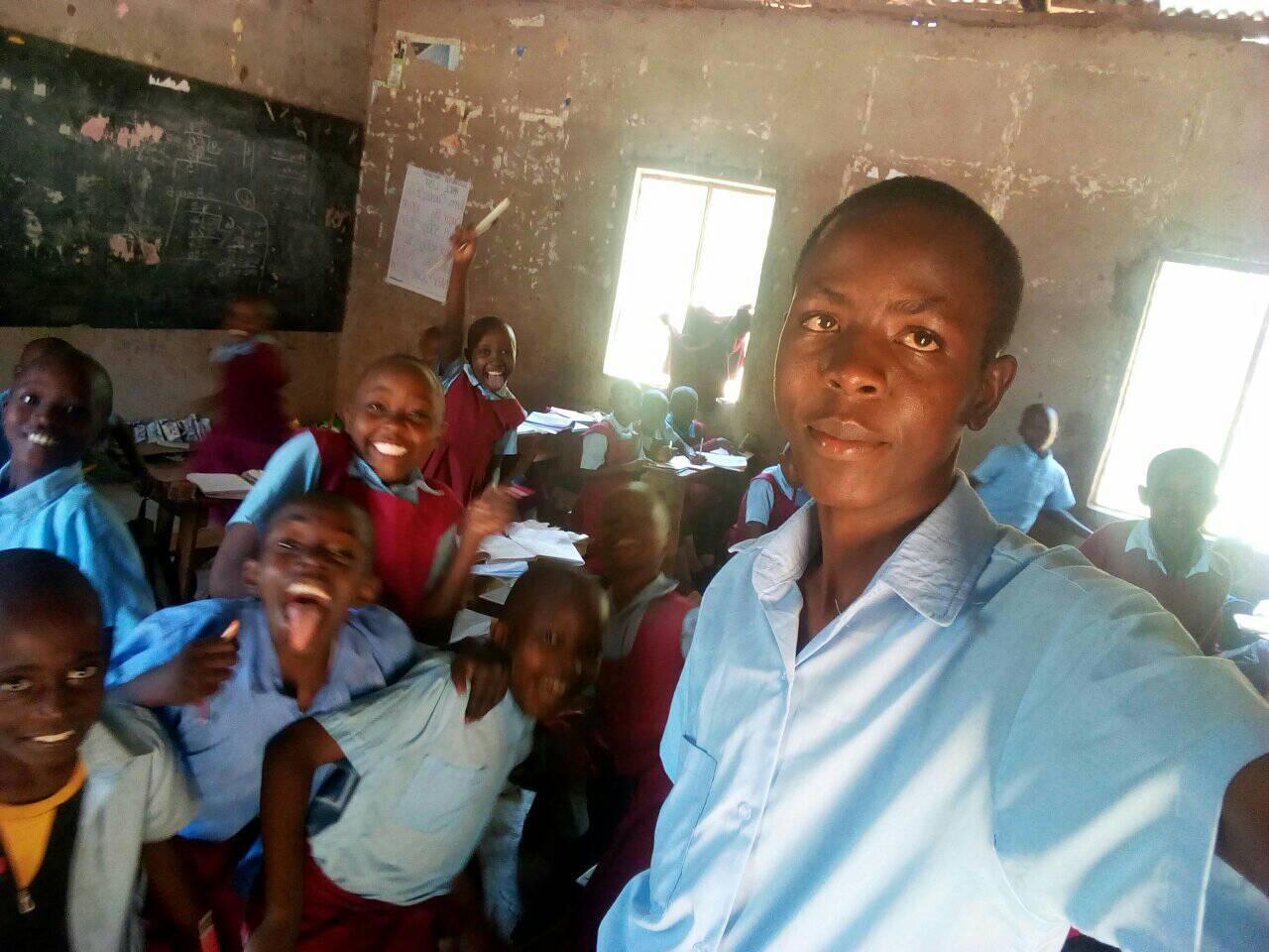 James with students in a classroom
