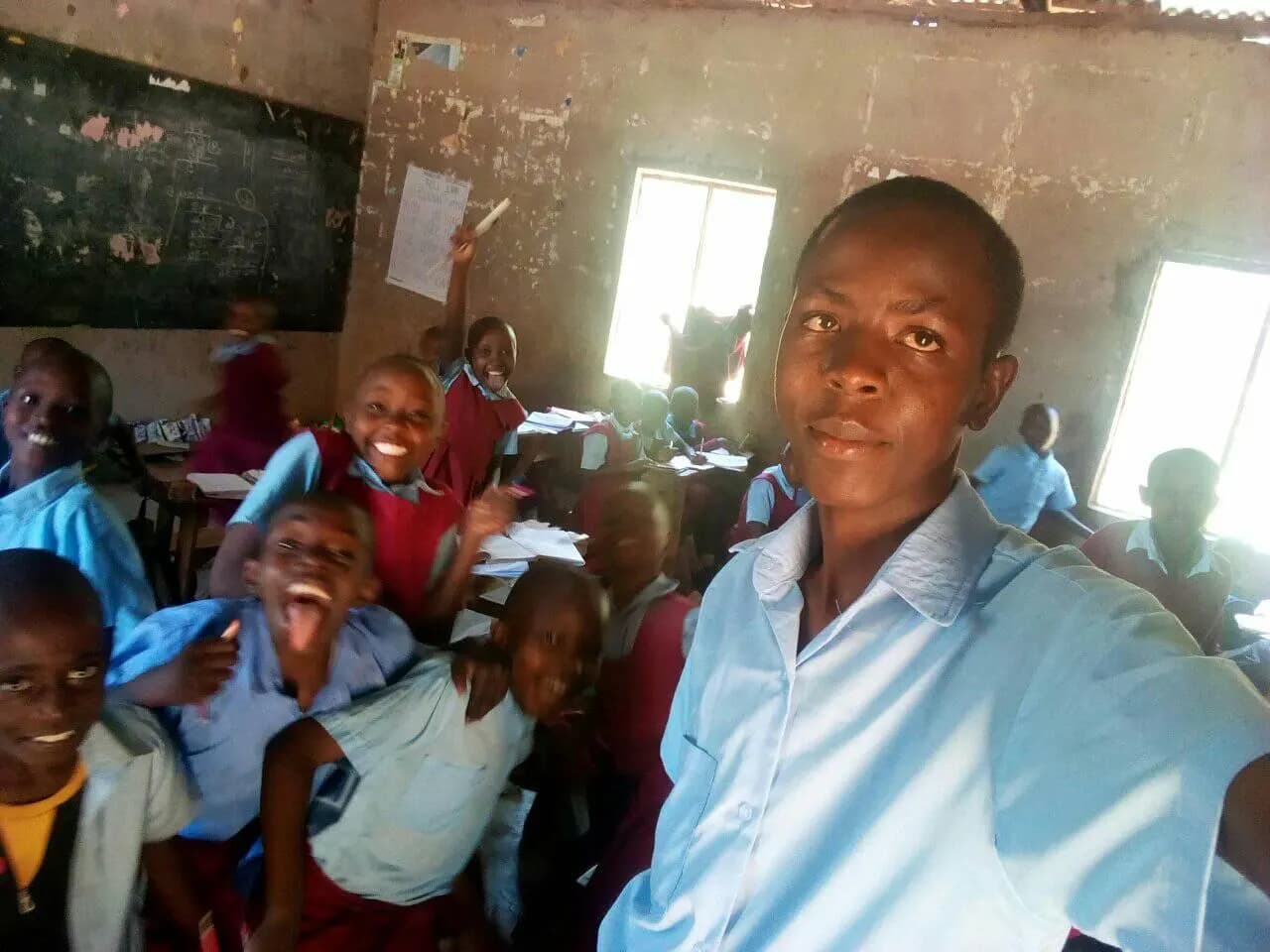 James with students in a classroom
