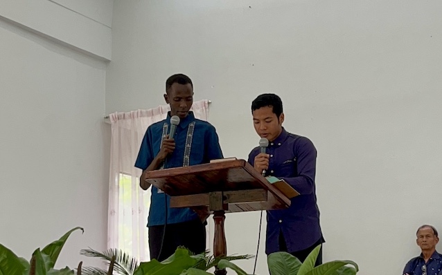 James speaking during a preaching engagement