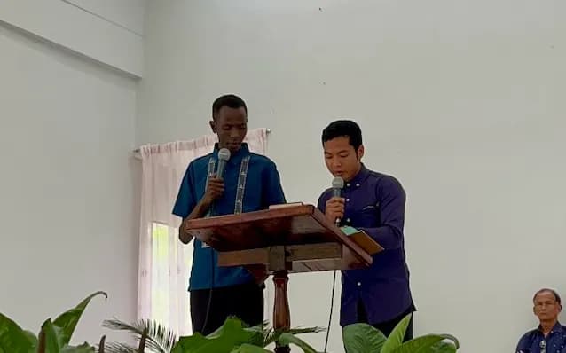 James speaking during a preaching engagement